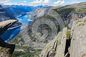 Tourism concept View of Trolltunga cliff. The Troll`s tongue Odda, Norway