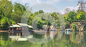 Tourism on the floating house rafting at the river Kwai