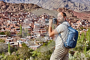 Tourism in Iran, solo traveler photographs the village of Abyane