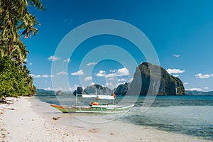 Tourism island hopping boat near Las sandy Cabanas beach, El Nido, Palawan, Philippines