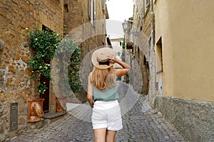 Tourism in Italy. Travel woman visiting historic medieval town of Orvieto, Umbria, Italy