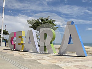 Tourism plate with inscription Ceara in large letters on the beachside in the city of Fortaleza, state of Ceara, Brazil