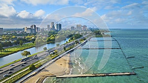 Tourism sandy beach along coast for Chicago travel aerial beside Lake Michigan on summer day