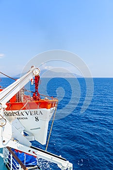 Tourism ship. Detail of the lifeboat, in the open sea, deep blue color.