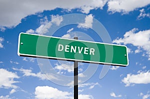 Tourism Street Sign with blue clouds