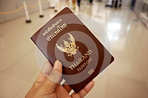 Tourism woman international holds a Thailand passport ready to boarding, Kansai International Airport