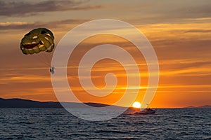 Parasailing at sunset, the Adriatic sea, Dalmatia, Makarska, Croatia