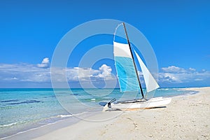 Tourist attractions on the Caribbean coast. Sailboat on the background of clear turquoise water in the sea and sky