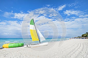 Tourist attractions on the Caribbean coast. Sailboat on the background of clear turquoise water in the sea and sky. Catamaran