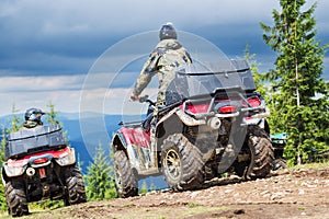 Tourist on ATV driving through the mountains