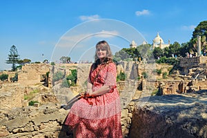 Tourist in the background of the archaeological Park of Carthage in Tunisia