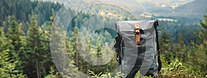 tourist backpack on the background of nature mountains