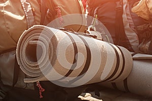 Tourist backpack with a camping mat