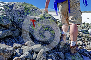 Tourist with backpack hiking to Gaustatoppen