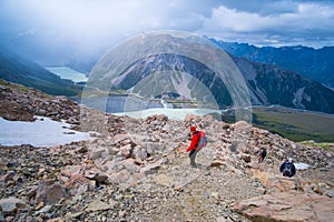 Tourist, backpacker, hiking in hight mountain on Muller hut track in Mt Cook National park I