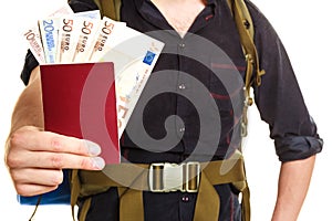 Tourist backpacker holding money and passport.
