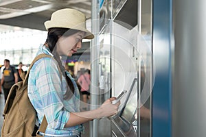 Tourist backpacker using smart phone pay