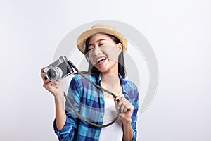 Tourist Beautiful of Asian woman holding a film camera  and smiling isolated on white background, Asia girl wear Plaid shirt and