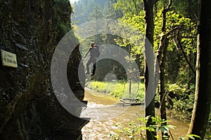 A tourist in the beautiful gorges of the Slovak Paradise National Park