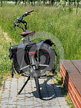 tourist bike with black panniers