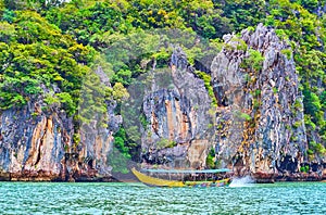 The tourist boat against the James Bond Island, Phang Nga, Thailand