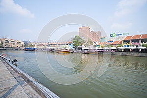 Tourist boat cruising the Singapore river at Clarke Quay