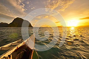 Tourist boat destinations on the island of El Nido at sunset. Ph