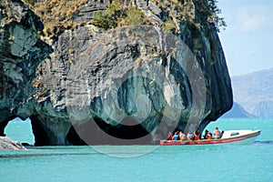 Tourist boat on excursion at Marble Caves, Capillas de Marmol island in Chile