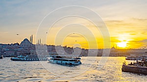 Tourist boat in Golden Horn Istanbul at sunset, Turkey