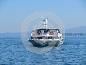 A tourist boat heading in Rorschach harbor from Austria