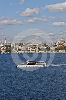 A Tourist Boat with Passengers on a Sightseeing trip along the Bosphorus Canal