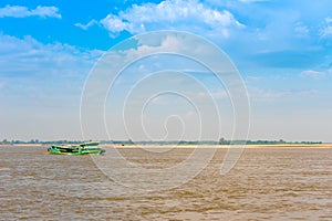 Tourist boat on the river Irrawaddy, Mandalay, Myanmar, Burma. Copy space for text.