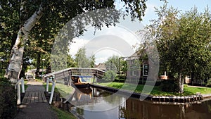 Tourist boat in romantic water village Giethoorn in the Netherlands