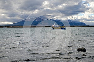 Tourist boat in the Ultima Esperanza Inlet from Puerto Natales.