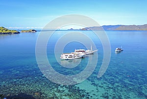 Tourist boats at Gili lawa island with a clear blue sea, Flores, Indonesia .