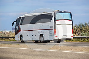 Tourist Bus Moves on Country Road