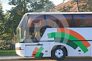 tourist bus traveling on city street