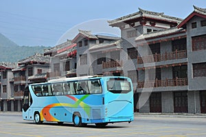 Tourist buses and modern antique buildings