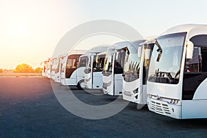 Tourist buses on parking at sunrise