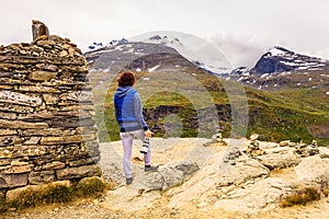 Tourist with camera in Norway mountains