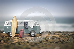 Tourist camp with bags, surfboard and car