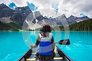 Tourist Canoeing on Moraine Lake in Banff National Park, Canadian Rockies, Alberta, Canada