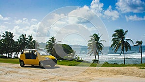 Tourist car parking in front of a lonely beach in Barbados