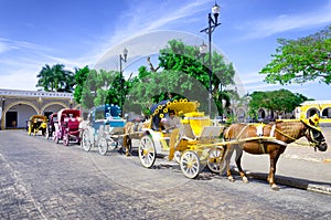 Tourist Carriages in Street in Izamal