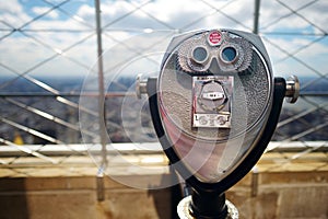 Tourist coin operated binoculars at the top of the Empire State Building in New York City