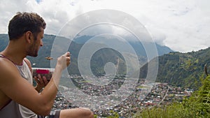 Tourist Contemplating The Landscape While Eating