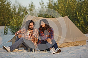 Tourist Couple Camping Near Tent Outdoors on Nature