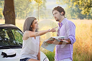 Tourist couple choosing the right direction