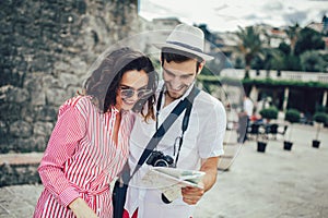 Tourist couple enjoying sightseeing, exploring city