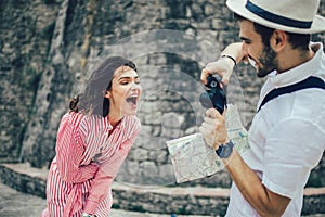 Tourist couple enjoying sightseeing, exploring city